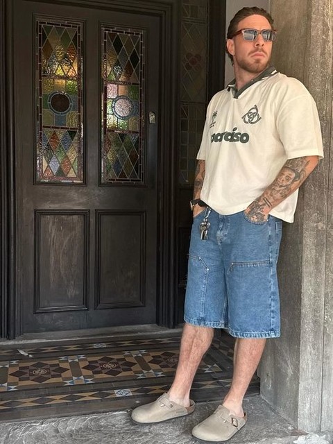 ASOS DESIGN oversized polo shirt in off white with paraiso front print